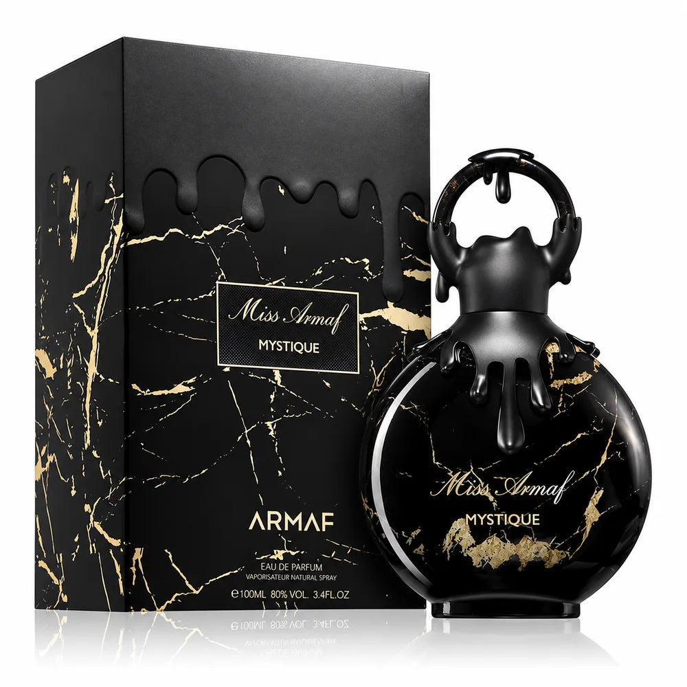 Флаконът и кутията на Miss Armaf Mystique EDP 100 мл, показани заедно с леко отражение.