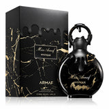 Флаконът и кутията на Miss Armaf Mystique EDP 100 мл, показани заедно с леко отражение.