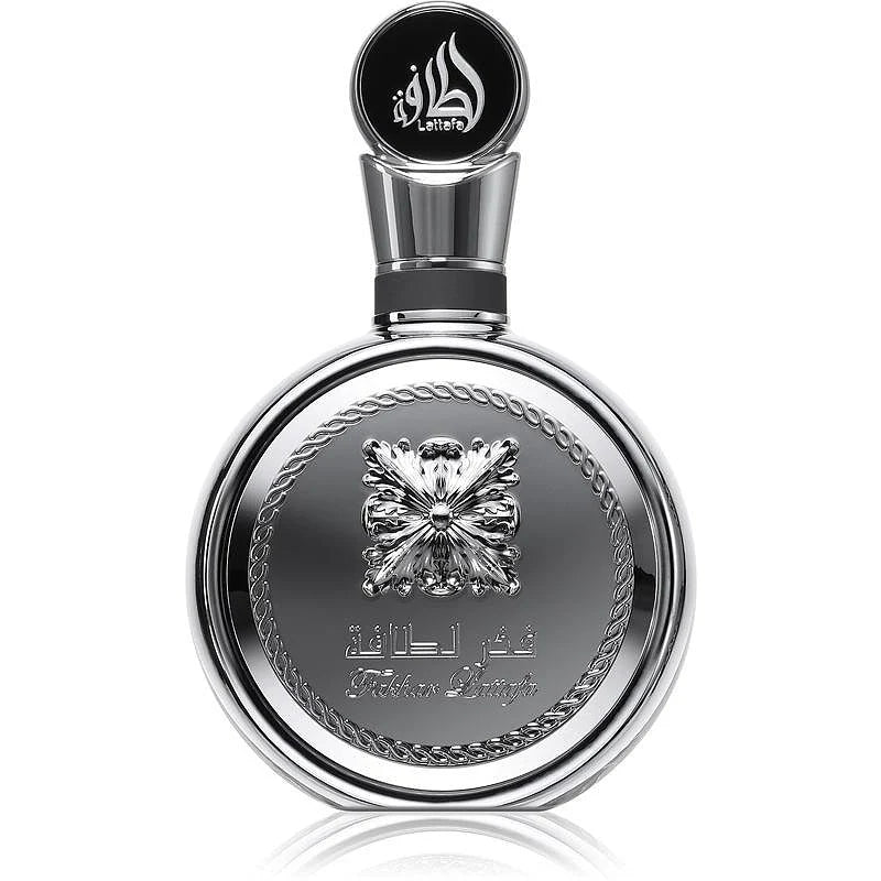 Флакон Lattafa Fakhar Platin EDP 100 мл с огледално отражение на бял фон.